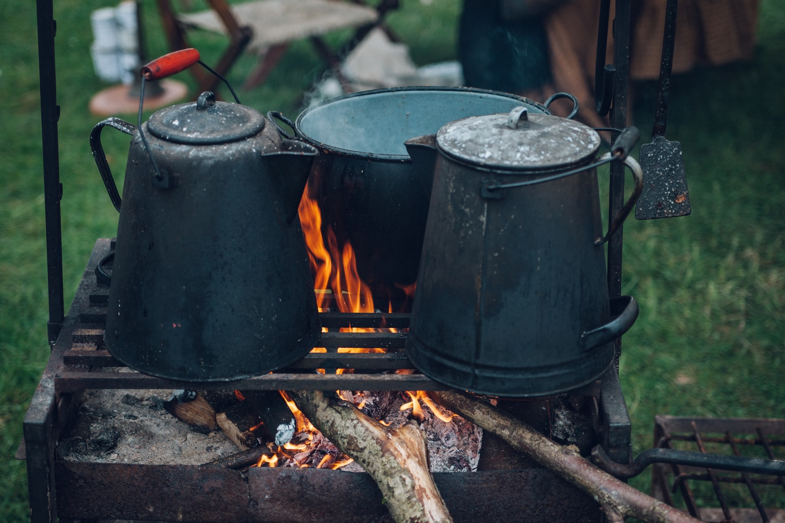 camping coffee - two kettles on the fire
